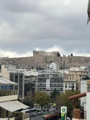 a city with a castle on top of a hill at Casa Acropolis - Stunning 3Br Apt with Private Terrace in Athens