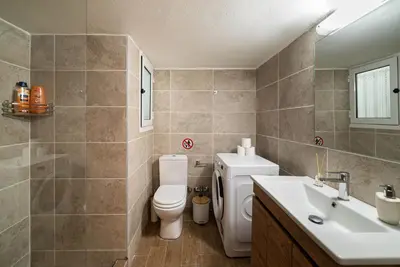 a bathroom with a toilet and a sink at Filoxenia MG Projects Acropolis Dimitrakopulou in Athens