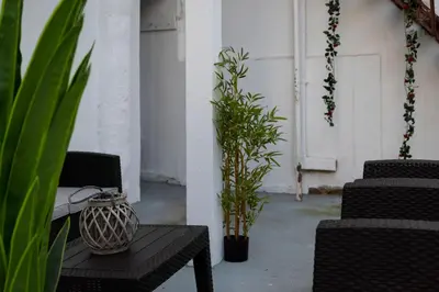 a room with a table and chairs and plants at Thissio Getaway 2BA next to Athens ancient market in Athens