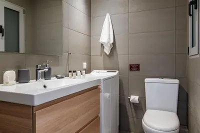 a bathroom with a sink and a toilet at Central Athens Loft C in Athens