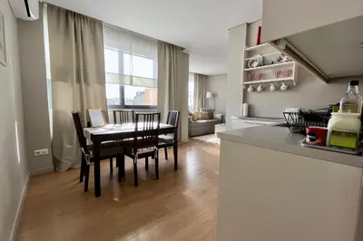 a kitchen and dining room with a table and chairs at Central Athens Loft C in Athens