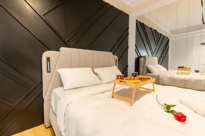 a bedroom with a large bed with a table on it at Platinum Jacuzzi Tsakalof 17 by Zeussuites in Athens