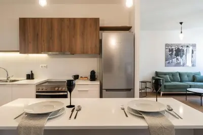 a kitchen with two white plates on a counter at Kypseli Elegant Living in Athens