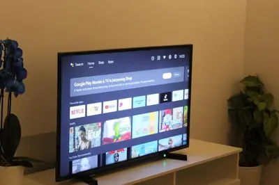 a flat screen tv sitting on top of a table at Urban-chic apartment in the heart of Athens in Athens