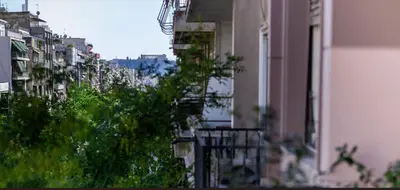 a view of a city with buildings and trees at Timeless Athens Cozy Apartment in Athens