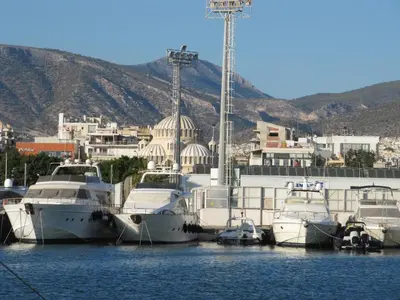 a bunch of boats are docked in the water at Cosy Studio at the heart of glyfada in Athens