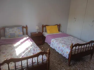 two twin beds in a room with at Family Athens, Enjoy Athens in Athens
