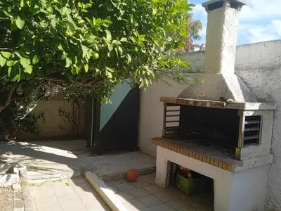 an outdoor oven sitting next to a wall at Family Athens, Enjoy Athens in Athens