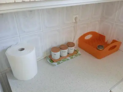 a roll of toilet paper on a shelf in a bathroom at Family Athens, Enjoy Athens in Athens