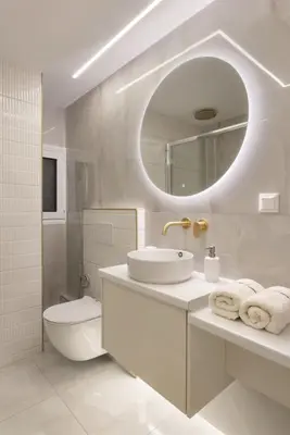 a bathroom with a sink and a toilet and a mirror at Elegant minimal studio in Kerameikos in Athens