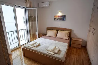 a bedroom with a bed with two towels on it at Newly Renovated 2-Bedroom Condo In Athens ! in Athens