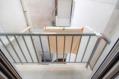 a staircase with a sink in a room at Newly Renovated 2-Bedroom Condo In Athens ! in Athens