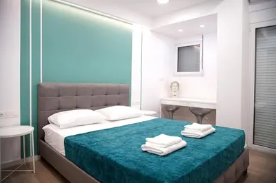 a bedroom with a bed with towels on it at Private Athens Retreat VIPGreece in Athens