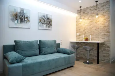a living room with a couch and a table at Private Athens Retreat VIPGreece in Athens