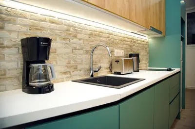 a kitchen counter with a sink and a coffee maker at Private Athens Retreat VIPGreece in Athens
