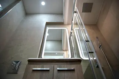 a small bathroom with a sink and a mirror at Private Athens Retreat VIPGreece in Athens