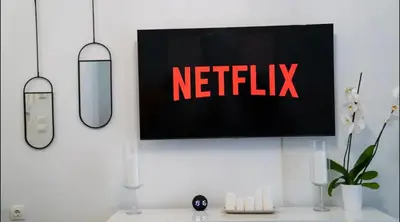 a television with a netflix sign on a wall at Luxury Apartment near Acropolis in the Heart of Athens in Athens