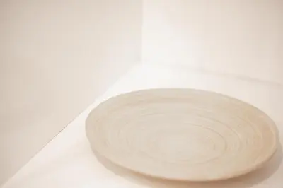a white plate sitting on top of a table at Art & Comfort Apartment in Athens in Athens