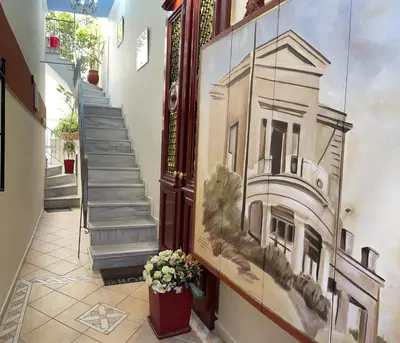 a painting of a building on the side of a building at Near to the Port in Piraeus