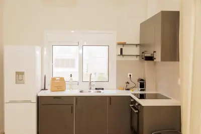 a small kitchen with a sink and a window at Modern 2BDR apartment in Pagrati in Athens