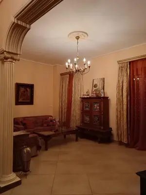 a living room with a couch and a table at Eleni's Astrous Home in Athens