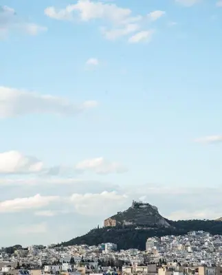 a view of a city with a mountain at The Penthouse Private Jacuzzi & Lycabettus View in Athens