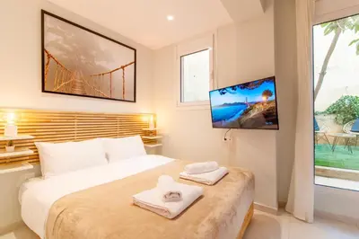 a bedroom with a bed with two towels on it at Solonaki Luxury Studio Apt in the heart of Athens in Athens