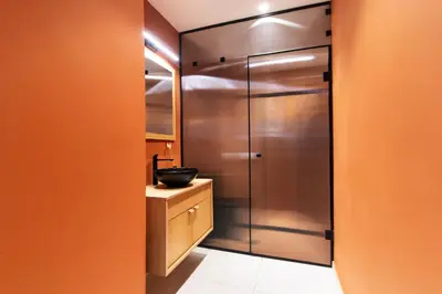 a bathroom with a stainless steel refrigerator and a sink at Solonaki Luxury Studio Apt in the heart of Athens in Athens