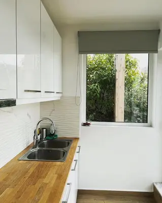 a kitchen with a sink and a window at Athens Hill Suite 2 in Athens