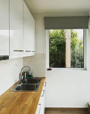 a kitchen with a sink and a window at Athens Hill Suite 2 in Athens