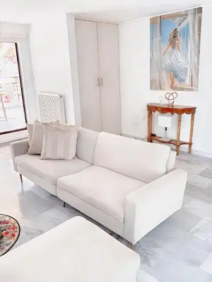 a white living room with a white couch at Chateau Lykabettus in Athens