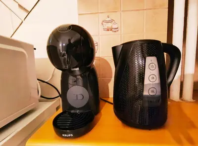 a coffee maker and a blender on a counter at TCG Ithakis in Athens