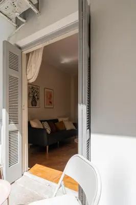 a living room with a couch and a chair at Kipseli Secret Heaven in Athens