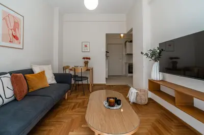 a living room with a couch and a coffee table at Kipseli Secret Heaven in Athens