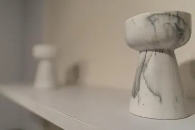a white vase sitting on top of a shelf at Kipseli Secret Heaven in Athens