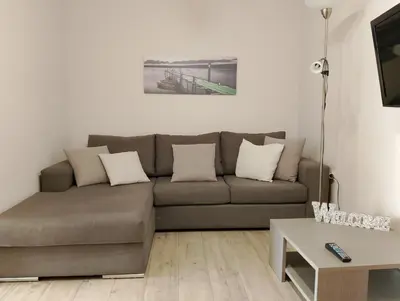 a living room with a couch and a table at Patisia Metro Station 2 bdrm apartment by MPS in Athens