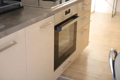 a kitchen with white cabinets and an oven at Patisia Metro Station 2 bdrm apartment by MPS in Athens