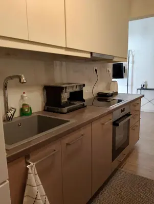 a kitchen with a sink and a stove top oven at Patisia Metro Station 2 bdrm apartment by MPS in Athens