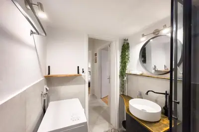 a bathroom with a sink and a mirror at Dream Apt in Ampelokipoi in Athens