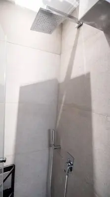 a bathroom with a shower stall with a ceiling at Apartment with Sea View Piraeus 4 people in Piraeus