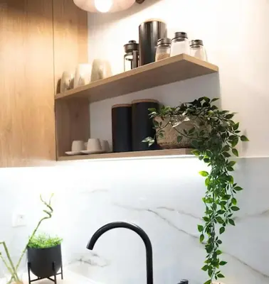 a kitchen counter with a sink and some plants at Apartment with Sea View Piraeus 4 people in Piraeus