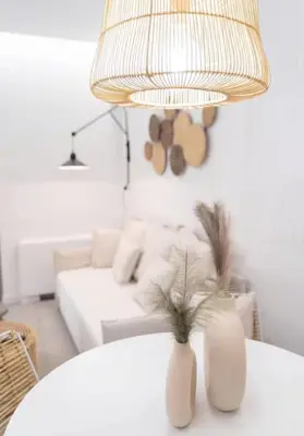 a living room with a white couch and a table with a lamp at Apartment with Sea View Piraeus 4 people in Piraeus