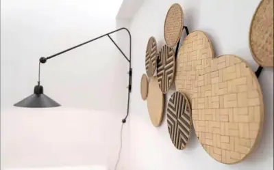 two wooden hearts hanging on a wall next to a lamp at Apartment with Sea View Piraeus 4 people in Piraeus