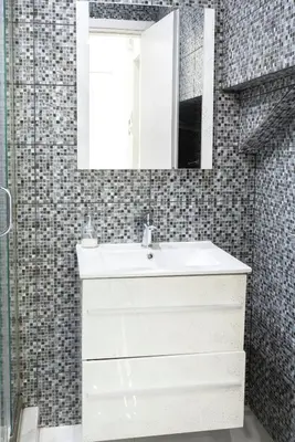 a bathroom with a white sink and a mirror at Arion in Athens