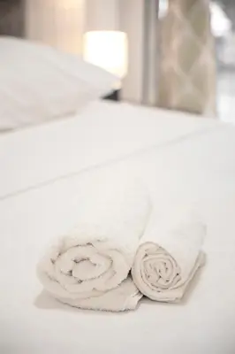 a white towel sitting on top of a bathroom sink at Arion in Athens
