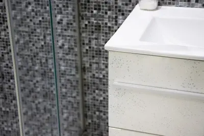 a bathroom with a white sink and a shower at Arion in Athens