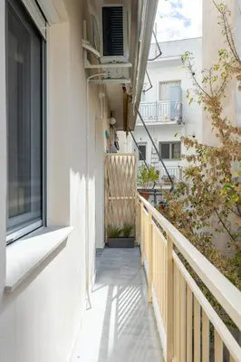 an empty balcony of a building with a window at EstelZan Apartment in Athens
