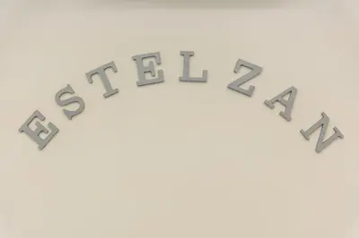 a group of gray numbers spelling out the word debt at EstelZan Apartment in Athens