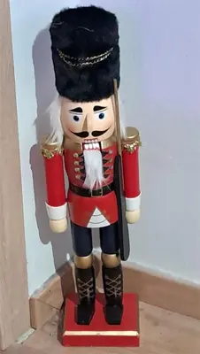a statue of a nutcracker on a red stand at West Athens Welcome Δυτικά της Αθήνας in Athens