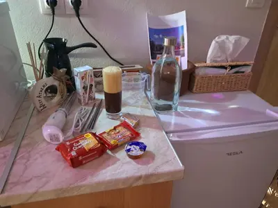 a counter top with food and a bottle on it at West Athens Welcome Δυτικά της Αθήνας in Athens